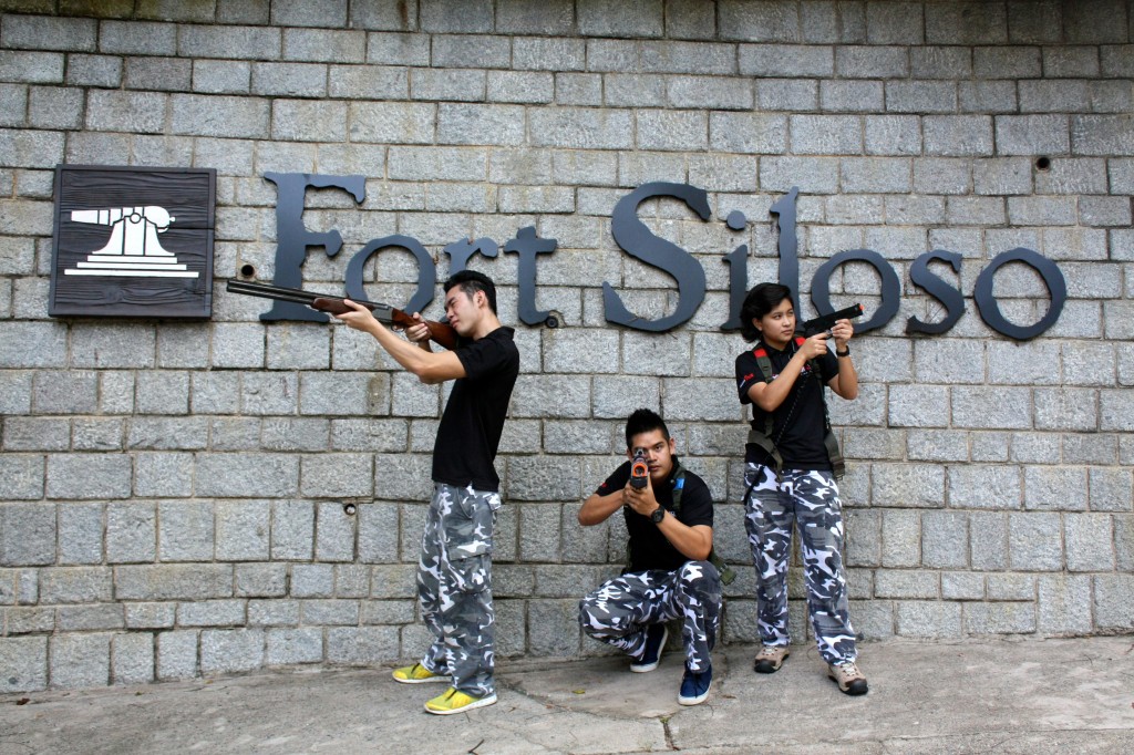 Staff posing with guns